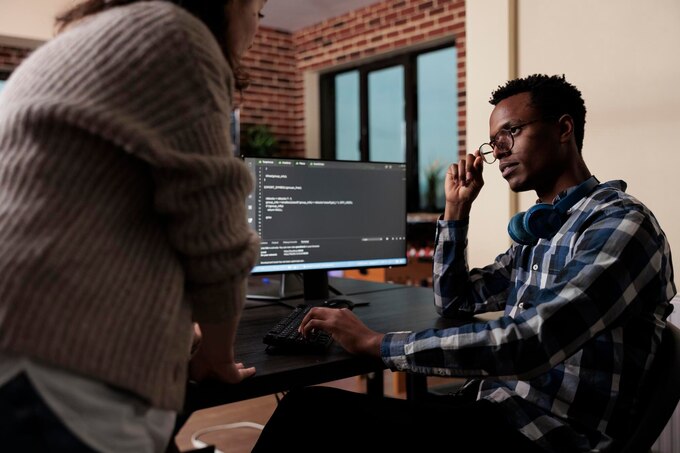 Developers writing code at desks